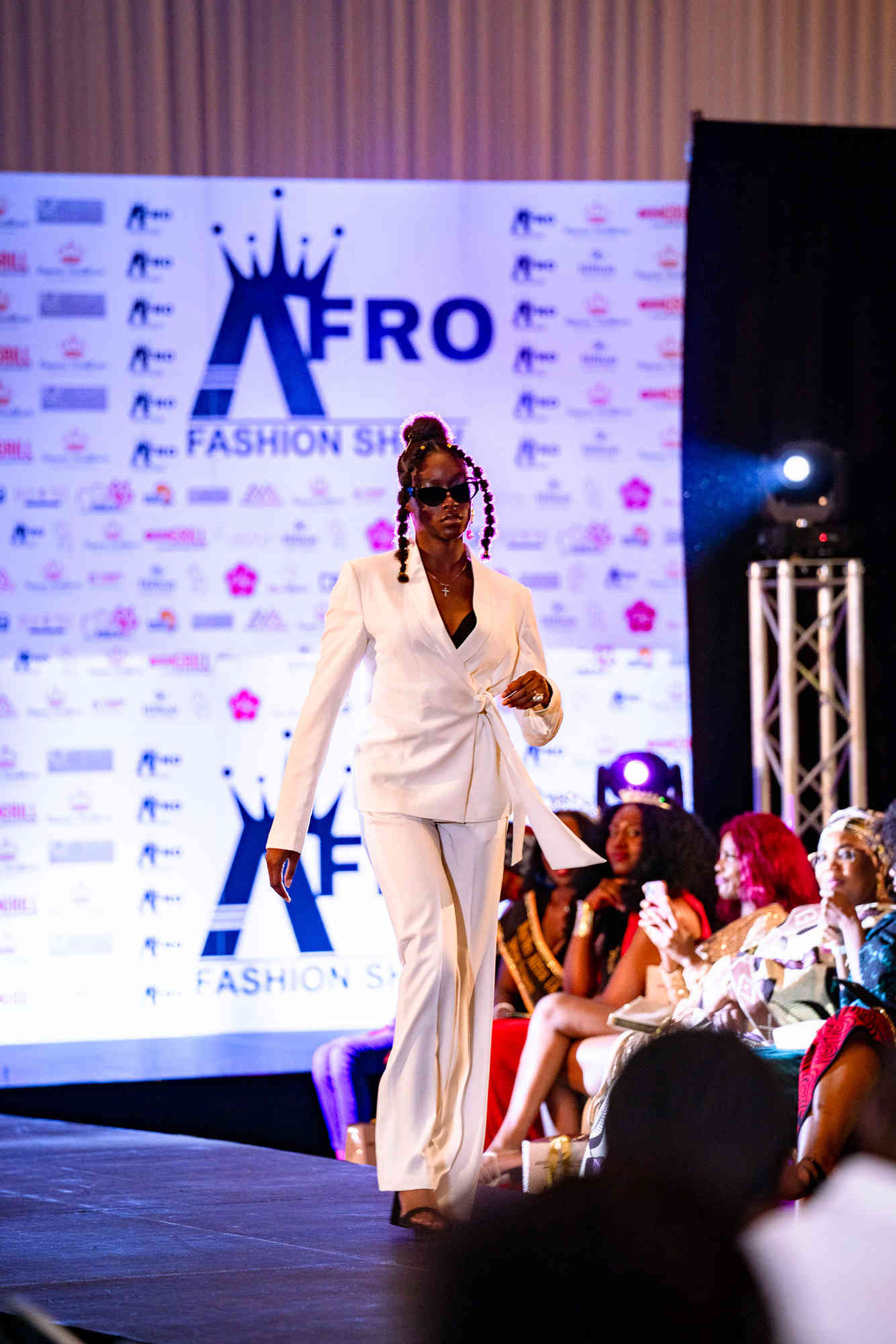 AfroFashion Week runway showcase 9: Model wearing couture fashion design