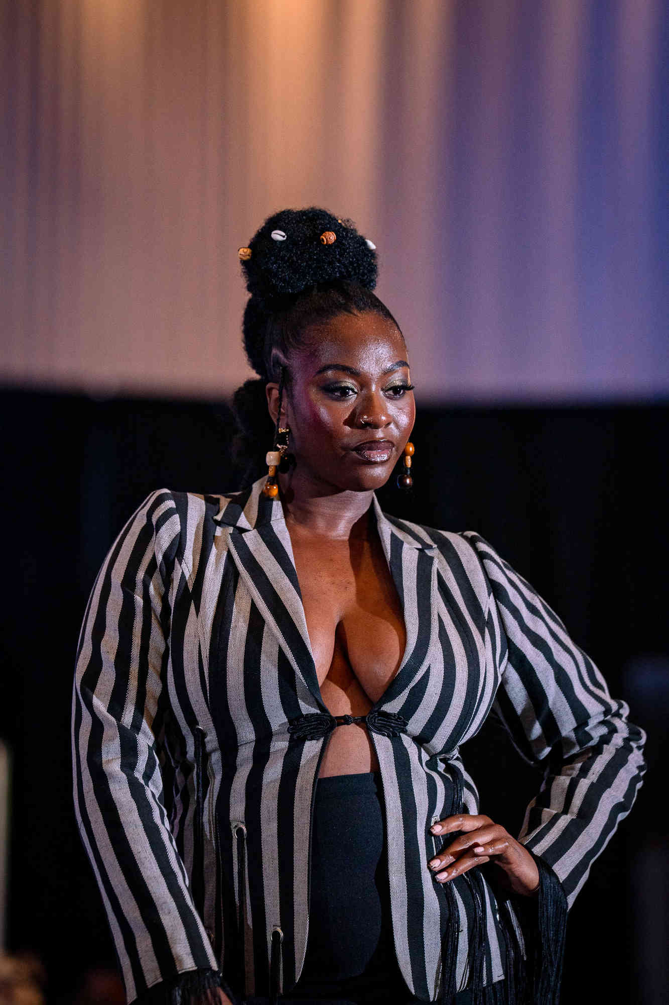 AfroFashion Week runway showcase 3: Model wearing couture fashion design