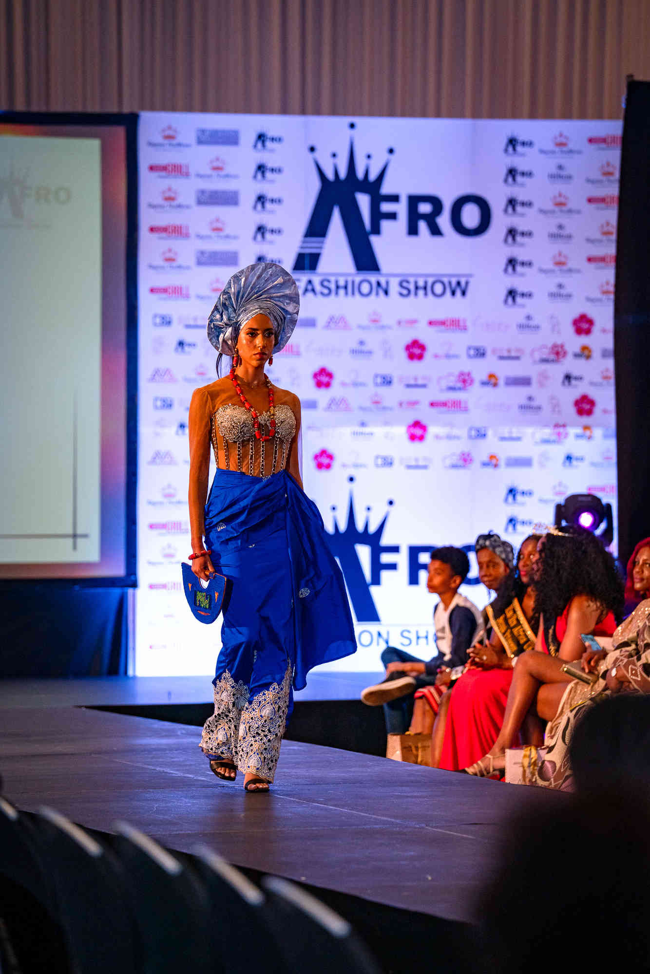 AfroFashion Week runway showcase 8: Model wearing couture fashion design
