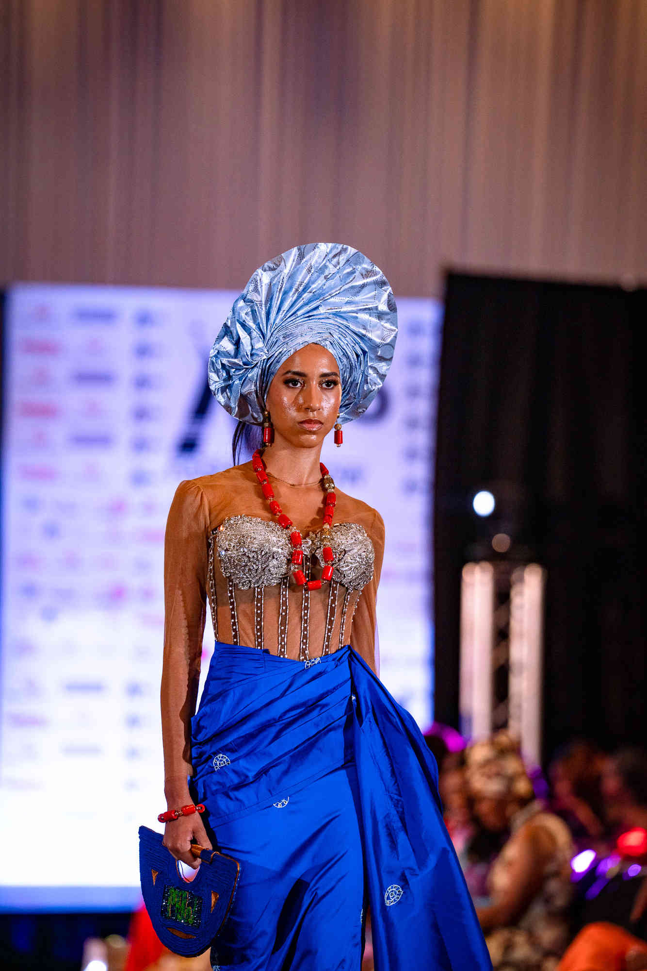 AfroFashion Week runway showcase 4: Model wearing couture fashion design