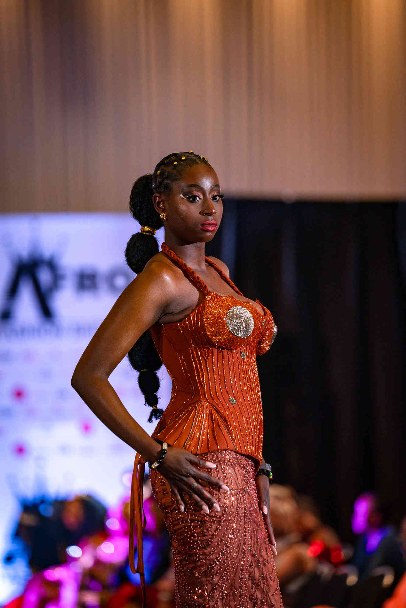 AfroFashion Week runway showcase 5: Model wearing couture fashion design